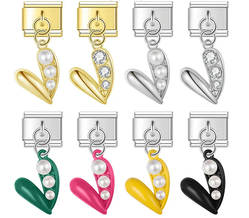 Set of heart-shaped clips with colored bodies and pearl-like centers, 