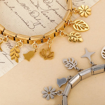 The Flower, Cross, Leaf & Bell Dangle Charm in Silver
