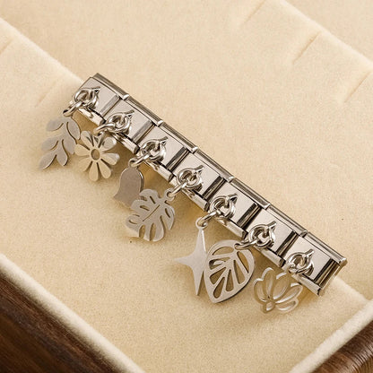 The Flower, Cross, Leaf & Bell Dangle Charm in Silver