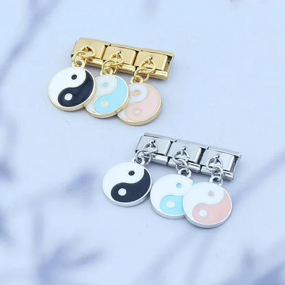 The Harmony Yin Yang Enamel Dangle Charm in Silver & Gold