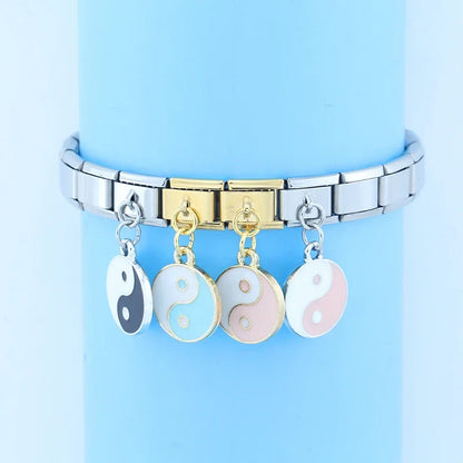 The Harmony Yin Yang Enamel Dangle Charm in Silver & Gold