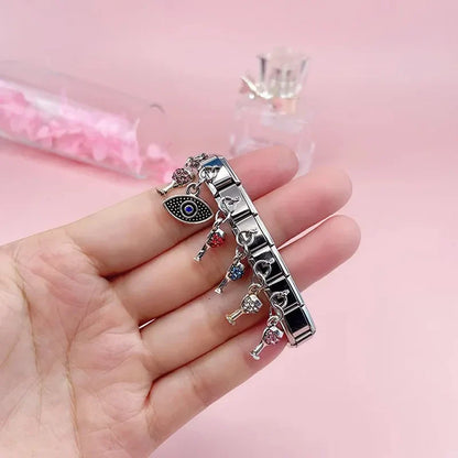 The Celebration Glass & Textured Eye Dangle Charm