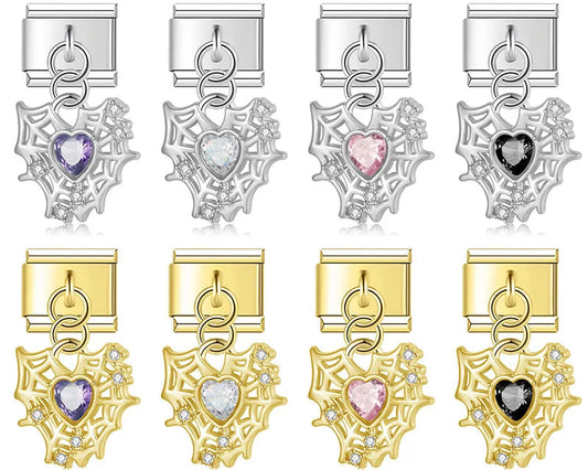 Set of silver and gold charms with heart-shaped gemstones on a white background