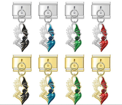 A 9mm Italian charm featuring a split heart dangle with one metallic angel wing and one colored enamel devil wing. Available in black, blue, green, and red on silver and gold bases.