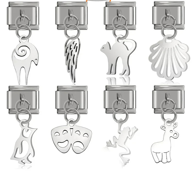 A collection of 8 silver dangle Italian charms on 9mm modular links featuring silhouettes of a cat, penguin, frog, ram, giraffe, seashell, angel wing, and theater masks - Charmtastic