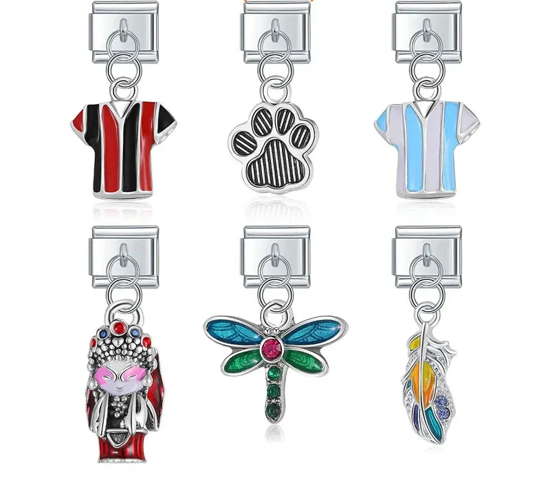 9mm silver Italian charm bracelet links featuring enamel sports jerseys, a textured paw print, an opera figure, a jeweled dragonfly, and a rainbow feather dangle.