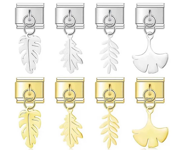 A set of 8 botanical leaf dangle Italian charms on silver and gold 9mm modular links featuring monstera, oak, fern, and gingko silhouettes - Charmtastic