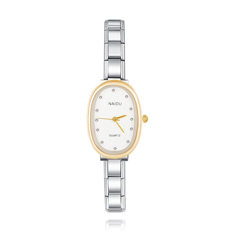 Silver and gold watch with white face on a white background