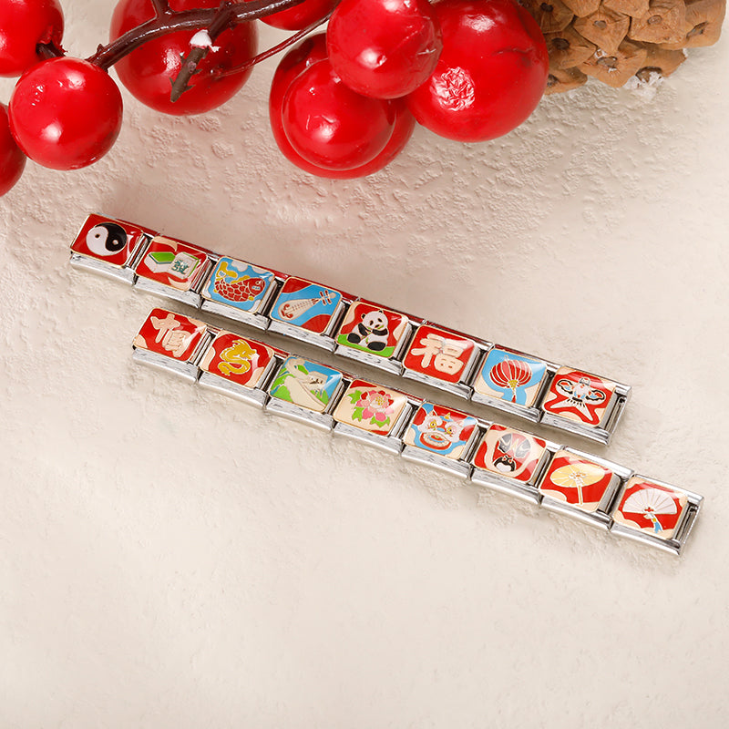 Chinese Heritage & Cultural Symbols Charms Tai Chi Kite – two Italian charm bracelets displayed on a table with red berries and pine decor, showing assorted Chinese cultural symbol charm links, Italian charm bracelets by Charmtastic
