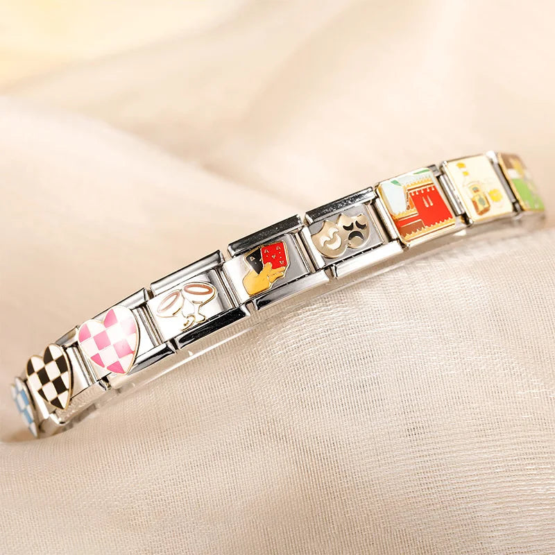 Colorful Heart, Cheers & Football Charm – charm bracelet close-up showing checkered heart, champagne glasses, playing cards and masks charms, Italian charm bracelet by Charmtastic