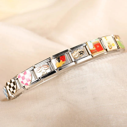 Colorful Heart, Cheers & Football Charm – charm bracelet close-up showing checkered heart, champagne glasses, playing cards and masks charms, Italian charm bracelet by Charmtastic