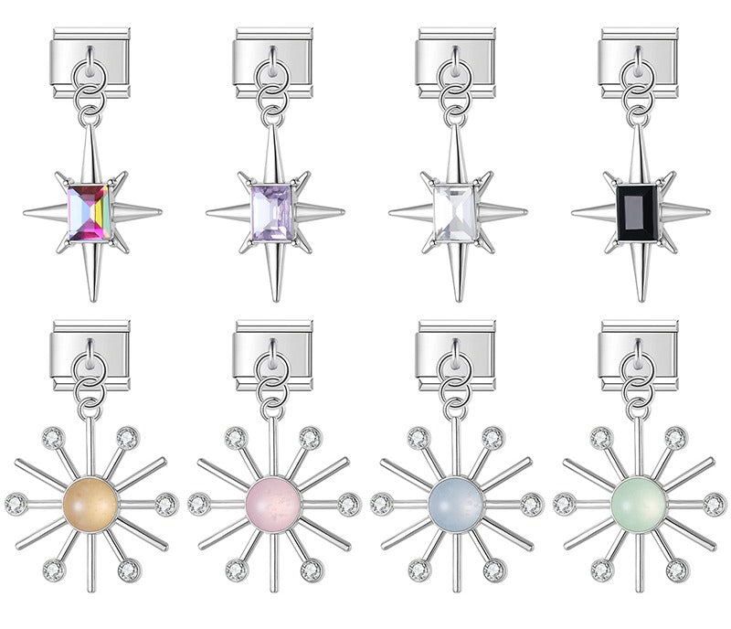 9mm silver Italian charm bracelet links featuring north star dangles with rectangular crystals and sunburst dangles with pastel cabochon centers.