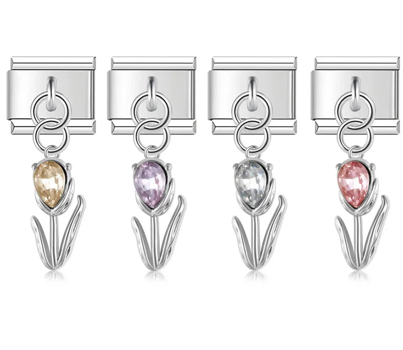 A set of 4 silver dangling Italian charms on 9mm modular links featuring tulip flowers with champagne, purple, clear, and pink crystal buds - Charmtastic