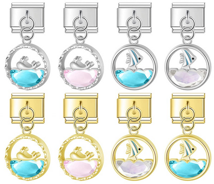 9mm Italian charm bracelet links in silver and gold featuring circular pendants with metallic dolphins and tropical fish over faceted blue, pink, and clear crystal waves.