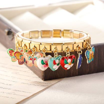 The Vibrant Enamel Butterfly & Floral Heart Dangle Charm in Gold