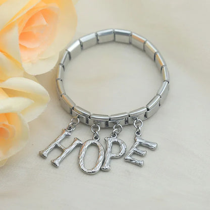 elegant silver dangle letters charms – HOPE spelled out with silver letter charms on an Italian charm bracelet by Charmtastic