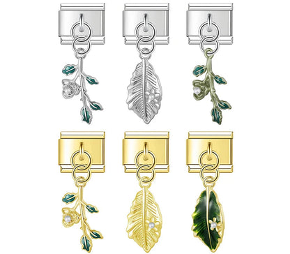 A collection of 9mm silver and gold Italian charms featuring delicate botanical dangles, including climbing rose branches and textured leaves with small pearl accents.