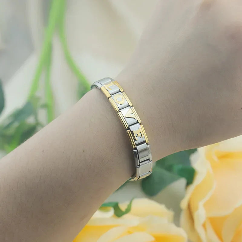 Gold & Silver Letter Initial Charm – charm bracelet on wrist spelling LOVE in gold letters, Italian charm bracelet by Charmtastic