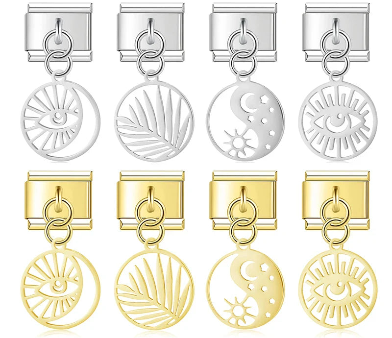 A collection of 9mm Italian charms featuring hollow round disc dangles. Designs include eyes, palm leaves, and celestial yin yang symbols. Available in polished silver and gold finishes.
