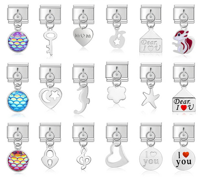 A collection of 9mm silver Italian charms featuring eclectic dangles including iridescent scales, mom hearts, skeleton keys, seahorses, love letters, and music notes.