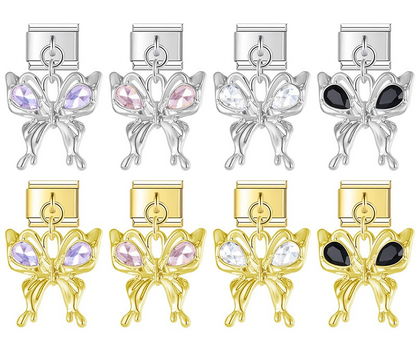 A 9mm Italian charm featuring a trendy, liquid-metal butterfly dangle accented with teardrop crystals. Available on silver and gold bases with purple, pink, clear, and black gems.