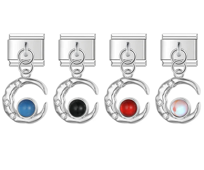 A collection of 4 silver dangle Italian charms on 9mm modular links featuring textured crescent moons with small clear crystals and round blue, black, red, and opal stones - Charmtastic