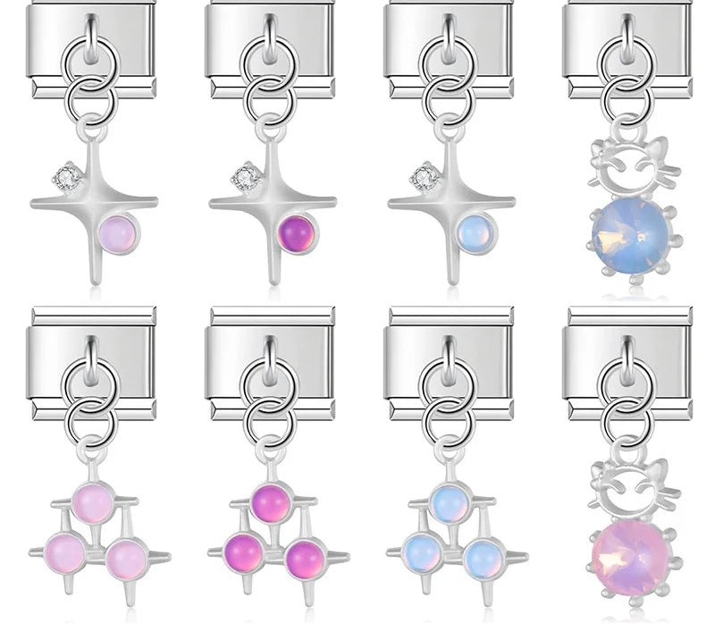 9mm silver Italian charm bracelet links featuring single and triple star dangles with pastel stones, and wireframe cat silhouettes with faceted iridescent pink and blue crystals.