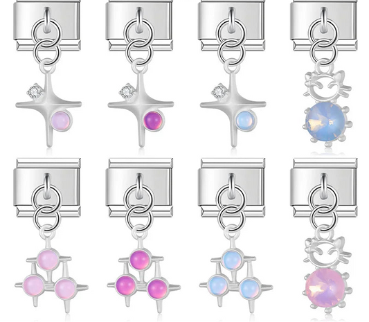 9mm silver Italian charm bracelet links featuring single and triple star dangles with pastel stones, and wireframe cat silhouettes with faceted iridescent pink and blue crystals.