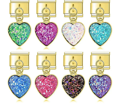 9mm gold-toned Italian charm bracelet links featuring dangle hearts filled with textured, sparkly druzy crystals in green, magenta, white, turquoise, sapphire, rose pink, black, and purple.