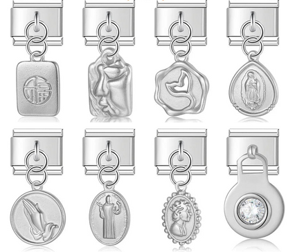 A collection of 9mm silver Italian charms featuring deeply sculpted dangles. Includes religious medals, a vintage cameo portrait, a crystal solitaire, an abstract face, a whale tail, and a good fortune tag.