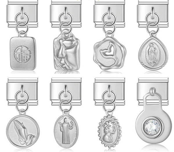 A collection of 9mm silver Italian charms featuring deeply sculpted dangles. Includes religious medals, a vintage cameo portrait, a crystal solitaire, an abstract face, a whale tail, and a good fortune tag.