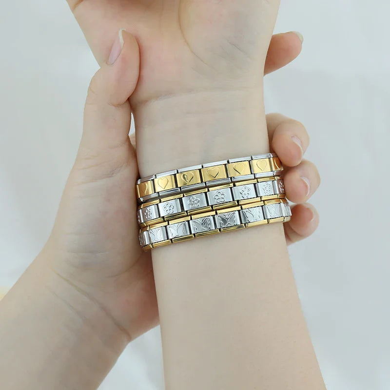silver with gold charms bracelet Star Heart Flower – butterfly and flower pattern Italian charm bracelets worn on wrist, by Charmtastic