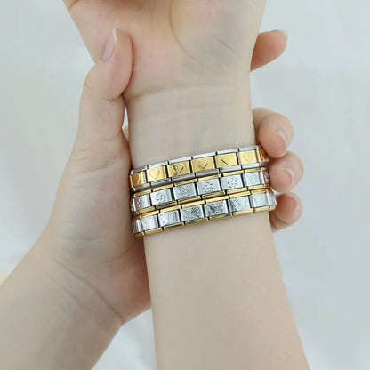 silver with gold charms bracelet Star Heart Flower – butterfly and flower pattern Italian charm bracelets worn on wrist, by Charmtastic