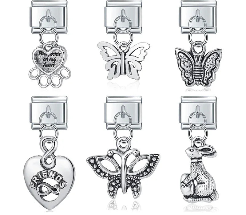 A collection of 6 vintage-style silver dangle Italian charms on 9mm modular links featuring detailed butterflies, a bunny, a Friends infinity heart, and a paw print memorial heart - Charmtastic