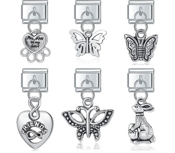 A collection of 6 vintage-style silver dangle Italian charms on 9mm modular links featuring detailed butterflies, a bunny, a Friends infinity heart, and a paw print memorial heart - Charmtastic