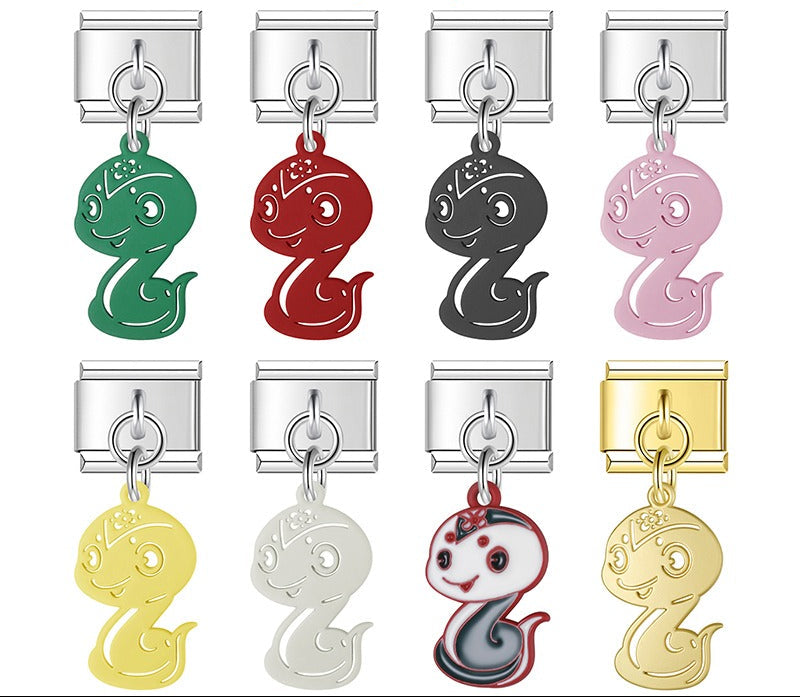 A 9mm Italian charm featuring a stylized snake dangle. Available in black, green, red, pink, yellow, white, multi-color, and solid gold.