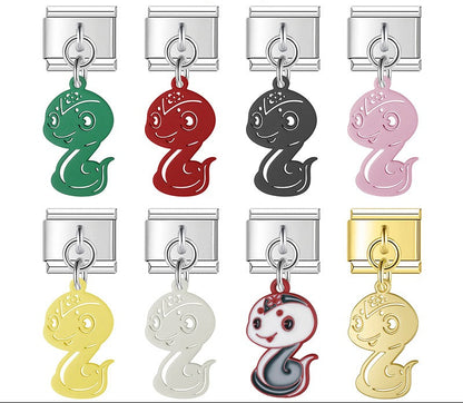 A 9mm Italian charm featuring a stylized snake dangle. Available in black, green, red, pink, yellow, white, multi-color, and solid gold.