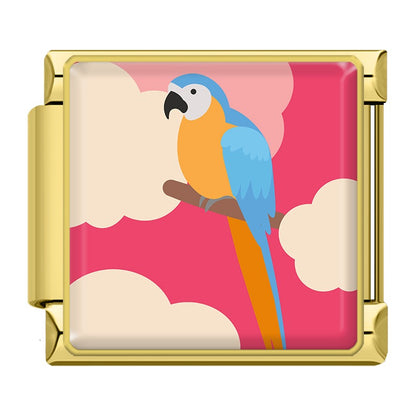 Wild Animal and Safari Wildlife Italian Charms – gold-framed blue and orange macaw parrot on a branch with pink cloudy background enamel charm, Italian charm bracelet charm by Charmtastic